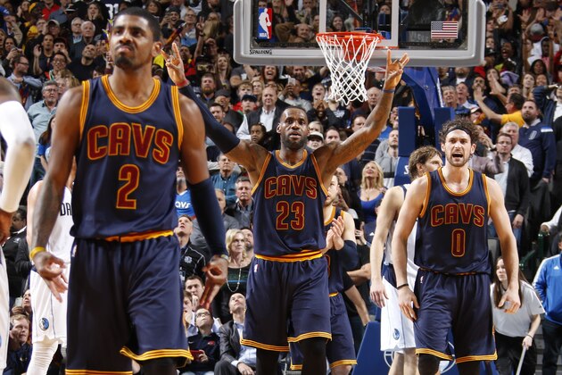 DALLAS, TX - JANUARY 12: Kyrie Irving #2, LeBron James #23 and Kevin Love #0 of the Cleveland Cavaliers celebrate a win against the Dallas Mavericks on January 12, 2016 at the American Airlines Center in Dallas, Texas. NOTE TO USER: User expressly acknowledges and agrees that, by downloading and or using this photograph, User is consenting to the terms and conditions of the Getty Images License Agreement. Mandatory Copyright Notice: Copyright 2016 NBAE (Photo by Danny Bollinger/NBAE via Getty Images)