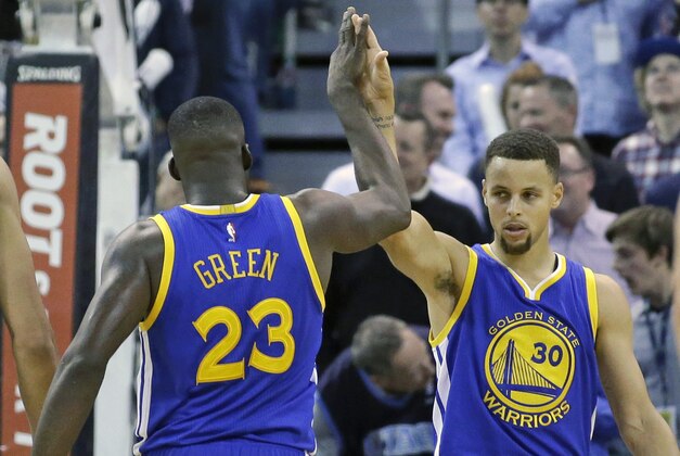Golden State Warriors' Draymond Green (23) high-fives Golden State Warriors guard Stephen Curry (30) in the second half during an NBA basketball game against the Utah Jazz Monday, Nov. 30, 2015, in Salt Lake City. Warriors won 106-103. (AP Photo/Rick Bowmer)