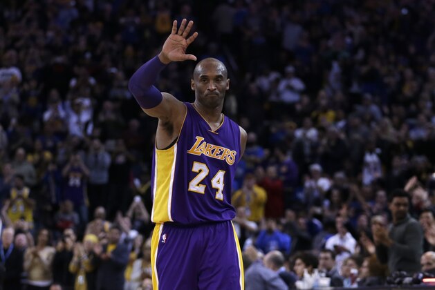 Los Angeles Lakers' Kobe Bryant waves to fans as he walks off the court during the fourth quarter of an NBA basketball game against the Golden State Warriors Thursday, Jan. 14, 2016, in Oakland, Calif. (AP Photo/Ben Margot)