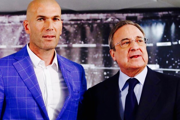 Real Madrid's President Florentino Perez, right, stands with newly appointed coach Zinedine Zidane at the Santiago Bernabeu stadium in Madrid, Spain, Monday Jan. 4, 2016. Real Madrid has fired coach Rafael Benitez after seven months and replaced him with former player Zinedine Zidane a day after Madrid's 2-2 draw at Valencia deepened a crisis that started with an embarrassing 4-0 home loss to rival Barcelona in November. (AP Photo)