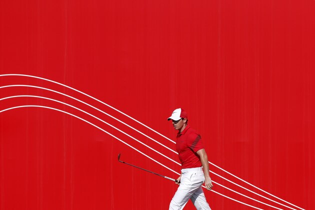 Rory McIlroy of Northern Ireland walks on the green during the first round of the Abu Dhabi Golf Championship in the capital of the United Arab Emirates on January 21, 2016. / AFP / KARIM SAHIB        (Photo credit should read KARIM SAHIB/AFP/Getty Images)