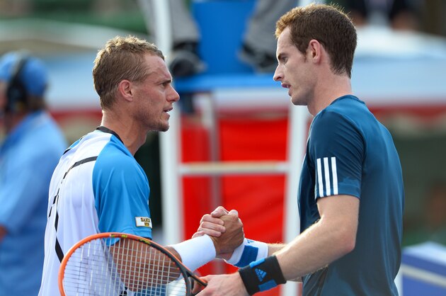 Lleyton Hewitt of Australia (L) shakes hands with Andy Murray of Scotland (R) after Hewitt won their exhibition match at the invitational Kooyong Classic tennis tournament in Melbourne on January 10, 2014.  The top male players are using the round-robin tournament as a warm-up for the Australia Open which starts January 13, 2014.  AFP PHOTO/William WEST    -- IMAGE RESTRICTED TO EDITORIAL USE - STRICTLY NO COMMERCIAL USE --        (Photo credit should read WILLIAM WEST/AFP/Getty Images)