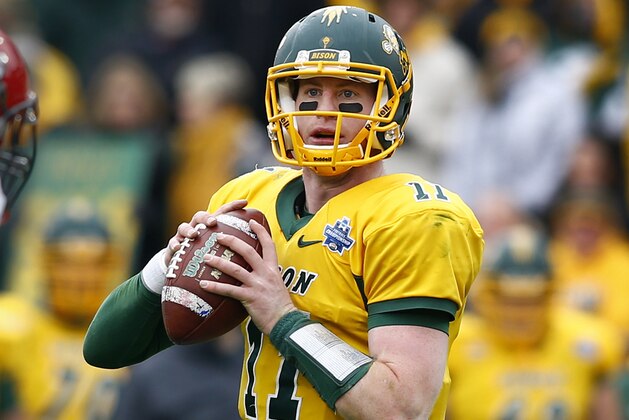 North Dakota State quarterback Carson Wentz (11) performs during the FCS championship NCAA college football game between North Dakota State and Jacksonville State, Saturday, Jan. 9, 2016, in Frisco, Texas.  North Dakota State beat Jacksonville State 37-10 to win their fifth consecutive championship.  (AP Photo/Mike Stone)