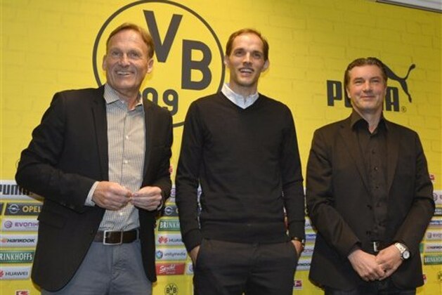 Borussia Dortmund's new head coach Thomas Tuchel, center, is presented by CEO Han-Joachim Watzke, left, and sporting manager Michael Zorc, right, at the stadium in Dortmund, Germany, Wednesday, June 3, 2015. Tuchel follows Juergen Klopp, who left the German first division soccer club BVB after seven years. (AP Photo/Martin Meissner) Borussia Dortmund's new head coach Thomas Tuchel, center, is presented by CEO Han-Joachim Watzke, left, and sporting manager Michael Zorc, right, at the stadium in Dortmund, Germany, Wednesday, June 3, 2015. Tuchel follows Juergen Klopp, who left the German first division soccer club BVB after seven years. (AP Photo/Martin Meissner)