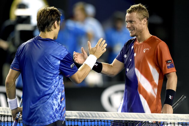 David Ferrer, left, of Spain is congratulated by Lleyton Hewitt of Australia after winning their second round match at the Australian Open tennis championships in Melbourne, Australia, Thursday, Jan. 21, 2016.(AP Photo/Andrew Brownbill)