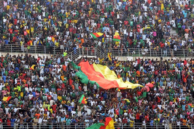 Cameroon supporters cheer their team during the 2015 African Cup of Nations (CAF) qualifier, group D, football match Cameroon vs DR Congo at the Ahmadou Ahidjo stadium in Yaounde  on November 15, 2014. Cameroon 1-0. AFP PHOTO/PACOME PABANDJI        (Photo credit should read PACOME PABANDJI/AFP/Getty Images)