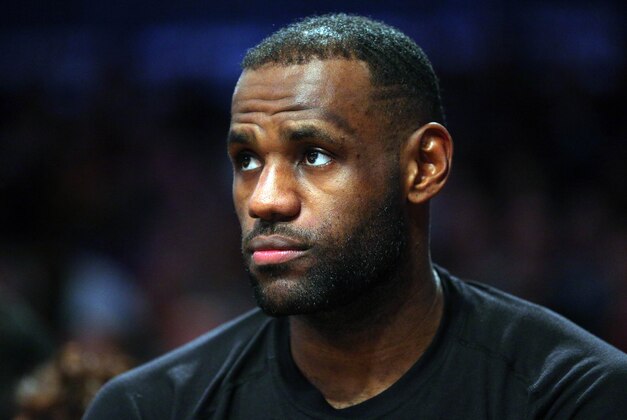 Jan 20, 2016; Brooklyn, NY, USA; Cleveland Cavaliers small forward LeBron James (23) watches from the bench during the fourth quarter against the Brooklyn Nets at Barclays Center. The Cavaliers defeated the Nets 91-78. Mandatory Credit: Brad Penner-USA TODAY Sports