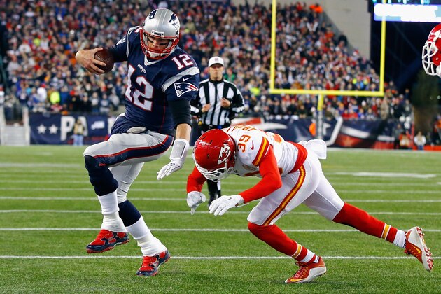 FOXBORO, MA - JANUARY 16: Tom Brady #12 of the New England Patriots runs for the end zone against Husain Abdullah #39 of the Kansas City Chiefs in the first half during the AFC Divisional Playoff Game at Gillette Stadium on January 16, 2016 in Foxboro, Massachusetts.  (Photo by Al Bello/Getty Images)