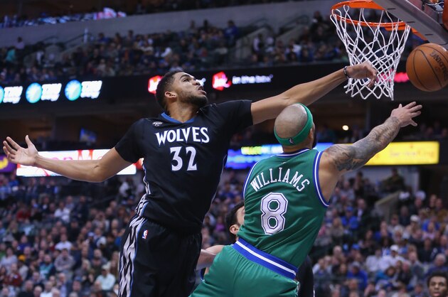 DALLAS, TX - JANUARY 20:  Karl-Anthony Towns #32 of the Minnesota Timberwolves blocks a shot by Deron Williams #8 of the Dallas Mavericks in the second half at American Airlines Center on January 20, 2016 in Dallas, Texas.  NOTE TO USER: User expressly acknowledges and agrees that, by downloading and or using this photograph, User is consenting to the terms and conditions of the Getty Images License Agreement.  (Photo by Ronald Martinez/Getty Images)