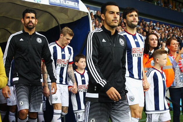 WEST BROMWICH, ENGLAND - AUGUST 23: Pedro of Chelsea walks out with Diego Costa (L) during the Barclays Premier League match between West Bromwich Albion and Chelsea at The Hawthorns on August 23, 2015 in West Bromwich, England.  (Photo by Julian Finney/Getty Images)