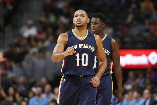 New Orleans Pelicans guards Eric Gordon (10) and Jrue Holiday (11) in the second half of an NBA basketball game Sunday, Dec. 20, 2015, in Denver. The Pelicans won 130-125. (AP Photo/David Zalubowski)