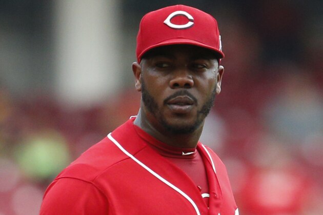 Cincinnati Reds relief pitcher Aroldis Chapman prepares to throw in the ninth inning of a baseball game against the Pittsburgh Pirates, Monday, Sept. 7, 2015, in Cincinnati. The Reds won 3-1. (AP Photo/John Minchillo)