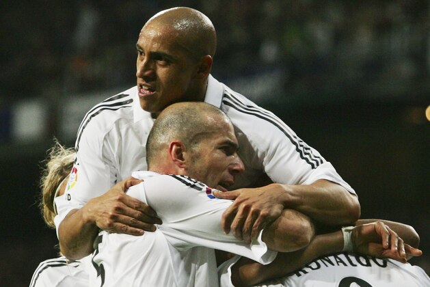 MADRID, SPAIN - DECEMBER 3:  Ronaldo (unseen) of Real Madrid celebrates with teammates Roberto Carlos (Above) and Zinedine Zidane after scoring a goal against Getafe during the Primera Liga match between Real Madrid and Getafe on December 3, 2005 at the Santiago Bernabeu stadium in Madrid, Spain. (Photo by Denis Doyle/Getty Images)