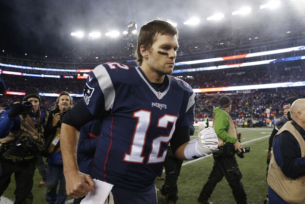 Jan 16, 2016; Foxborough, MA, USA; New England Patriots quarterback Tom Brady (12) runs off the field after defeating the Kansas City Chiefs 27-20 during the second half in the AFC Divisional round playoff game at Gillette Stadium. Mandatory Credit: David Butler II-USA TODAY Sports