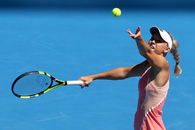 Caroline Wozniacki of Denmark serves to Yulia Putintseva of Kazakhstan during their first round match at the Australian Open tennis championships in Melbourne, Australia, Monday, Jan. 18, 2016.(AP Photo/Rick Rycroft)