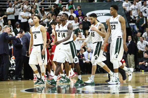 EAST LANSING, MI - JANUARY 20: Bryn Forbes #5, Javon Bess #2, Eron Harris #14, Denzel Valentine #45 and Deyonta Davis #23 of the Michigan State Spartans walk to the bench during a timeout late in the second half against the Nebraska Cornhuskers at the Breslin Center on January 20, 2016 in East Lansing, Michigan. (Photo by Rey Del Rio/Getty Images)