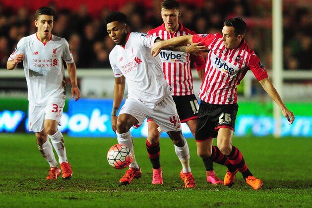 EXETER, ENGLAND - JANUARY 08:  Jerome Sinclair of Liverpool holds off Jordan Tillson of Exeter City during the Emirates FA Cup third round match between Exeter City and Liverpool at St James Park on January 8, 2016 in Exeter, England.  (Photo by Dan Mullan/Getty Images)