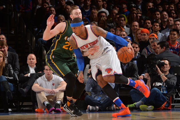 NEW YORK,NY - JANUARY 20: Carmelo Anthony #7 of the New York Knicks drives around to the basket against the Utah Jazz at Madison Square Garden on January 20, 2016 in New York,New York NOTE TO USER: User expressly acknowledges and agrees that, by downloading and/or using this Photograph, user is consenting to the terms and conditions of the Getty Images License Agreement. Mandatory Copyright Notice: Copyright 2016 NBAE (Photo by Jesse D. Garrabrant/NBAE via Getty Images)