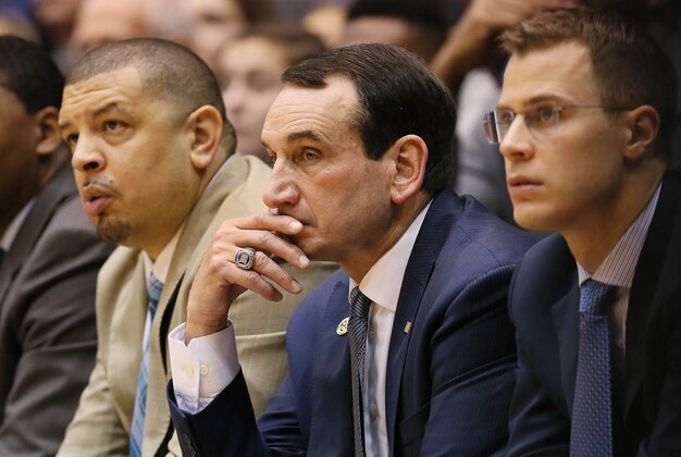 Dec 30, 2015; Durham, NC, USA; Duke Blue Devils associate head coach Jeff Capel and head coach Mike Krzyzewski and assistant coach Jon Scheyer watch their team from the sidelines in their game against the Long Beach State 49ers at Cameron Indoor Stadium. Mandatory Credit: Mark Dolejs-USA TODAY Sports