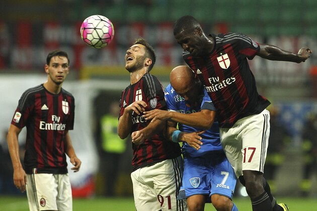 MILAN, ITALY - AUGUST 29: Massimo Maccarone (C) of Empoli FC competes for the ball with Andrea Bertolacci (L) and Cristian Zapata (R) of AC Milan during the Serie A match between AC Milan and Empoli FC at Stadio Giuseppe Meazza on August 29, 2015 in Milan, Italy. (Photo by Marco Luzzani/Getty Images) MILAN, ITALY - AUGUST 29: Massimo Maccarone (C) of Empoli FC competes for the ball with Andrea Bertolacci (L) and Cristian Zapata (R) of AC Milan during the Serie A match between AC Milan and Empoli FC at Stadio Giuseppe Meazza on August 29, 2015 in Milan, Italy. (Photo by Marco Luzzani/Getty Images)