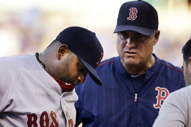 Boston Red Sox third baseman Pablo Sandoval, left, is checked out by a trainer, right, and manager John Farrell, middle, during the fifth inning of a baseball game against the Kansas City Royals at Kauffman Stadium in Kansas City, Mo., Saturday, June 20, 2015. Sandoval left the game. (AP Photo/Orlin Wagner) Boston Red Sox third baseman Pablo Sandoval, left, is checked out by a trainer, right, and manager John Farrell, middle, during the fifth inning of a baseball game against the Kansas City Royals at Kauffman Stadium in Kansas City, Mo., Saturday, June 20, 2015. Sandoval left the game. (AP Photo/Orlin Wagner)