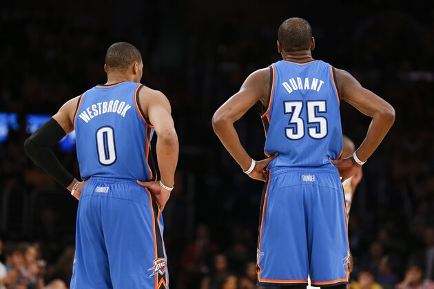 Oklahoma City Thunder point guard Russell Westbrook and Oklahoma City Thunder small forward Kevin Durant stand together on the court against the Los Angeles Lakers during the second half of an NBA basketball game in Los Angeles, Sunday, March 9, 2014. The Lakers won 114-110. (AP Photo/Danny Moloshok)