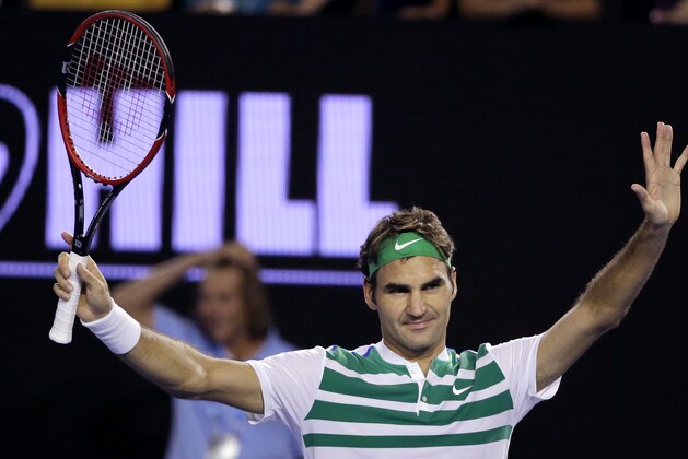 Roger Federer of Switzerland celebrates after defeating Grigor Dimitrov of Bulgaria during their third round match at the Australian Open tennis championships in Melbourne, Australia, Friday, Jan. 22, 2016.(AP Photo/Aaron Favila)