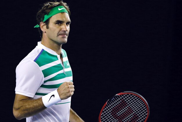 Roger Federer of Switzerland celebrates after defeating Grigor Dimitrov of Bulgaria in their third round match at the Australian Open tennis championships in Melbourne, Australia, Friday, Jan. 22, 2016.(AP Photo/Aaron Favila)