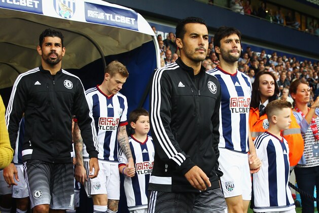 WEST BROMWICH, ENGLAND - AUGUST 23: Pedro of Chelsea walks out with Diego Costa (L) during the Barclays Premier League match between West Bromwich Albion and Chelsea at The Hawthorns on August 23, 2015 in West Bromwich, England.  (Photo by Julian Finney/Getty Images)
