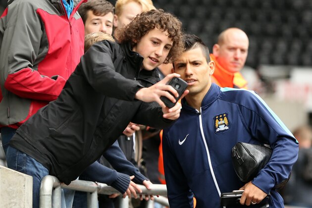 SWANSEA, WALES - MAY 17: Sergio Aguero of Manchester City poses for a selfie as he arrives prior to the Premier League match between Swansea City and Manchester City at The Liberty Stadium on May 17, 2015 in Swansea, Wales. (photo by Athena Pictures/Getty Images)
