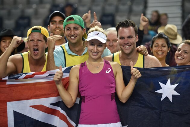 Australia's Daria Gavrilova (C) takes a selfie with fans as she celebrates her victory against France's Kristina Mladenovic during their women's singles match on day five of the 2016 Australian Open tennis tournament in Melbourne on January 22, 2016. AFP PHOTO / PETER PARKS -- IMAGE RESTRICTED TO EDITORIAL USE - STRICTLY NO COMMERCIAL USE / AFP / PETER PARKS        (Photo credit should read PETER PARKS/AFP/Getty Images)