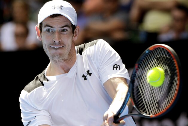 Andy Murray of Britain makes a backhand return to Sam Groth of Australia during their second round match at the Australian Open tennis championships in Melbourne, Australia, Thursday, Jan. 21, 2016.(AP Photo/Aaron Favila)