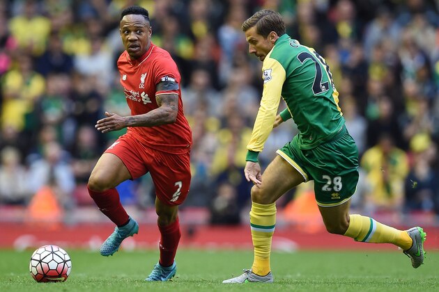 Liverpool's English defender Nathaniel Clyne (L) competes with Norwich City's English midfielder Gary O'Neil during the English Premier League football match between Liverpool and Norwich City at the Anfield stadium in Liverpool, north-west England on September 20, 2015. AFP PHOTO / PAUL ELLIS  RESTRICTED TO EDITORIAL USE. No use with unauthorized audio, video, data, fixture lists, club/league logos or 'live' services. Online in-match use limited to 75 images, no video emulation. No use in betting, games or single club/league/player publications.        (Photo credit should read PAUL ELLIS/AFP/Getty Images)