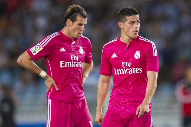 SAN SEBASTIAN, SPAIN - AUGUST 31:  James Rodriguez and Gareth Bale of Real Madrid reacts during the La Liga match between Real Sociedad and Real Madrid CF at Estadio Anoeta on August 31, 2014 in San Sebastian, Spain.  (Photo by Juan Manuel Serrano Arce/Getty Images)