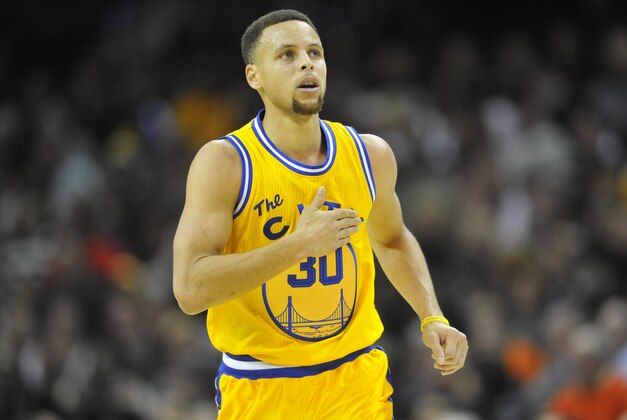 Jan 18, 2016; Cleveland, OH, USA; Golden State Warriors guard Stephen Curry (30) celebrates a three-point basket in the third quarter against the Cleveland Cavaliers at Quicken Loans Arena. Mandatory Credit: David Richard-USA TODAY Sports