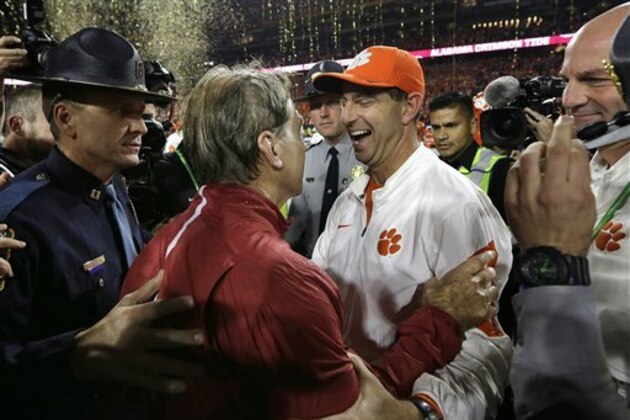 Clemson head coach Dabo Swinney, right, congratulates Alabama head coach Nick Saban after the NCAA college football playoff championship game Monday, Jan. 11, 2016, in Glendale, Ariz. Alabama won 45-40. (AP Photo/David J. Phillip)