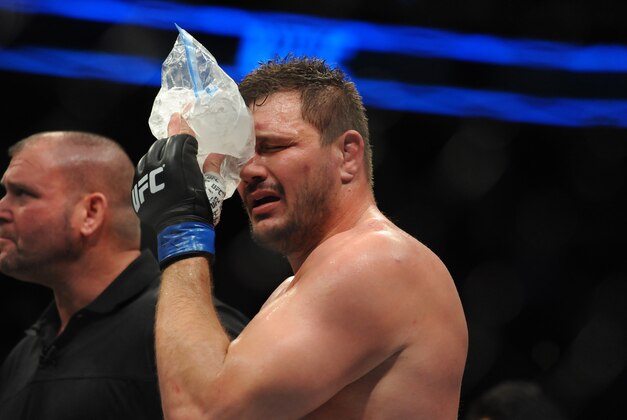 Jan 17, 2016; Boston, MA, USA; Matt Mitrione (blue) holds ice to his eye after a heavyweight bout against Travis Browne (not pictured) at UFC Fight Night at the TD Garden. Browne won after three rounds by technical knock-out.   Mandatory Credit: Bob DeChiara-USA TODAY Sports