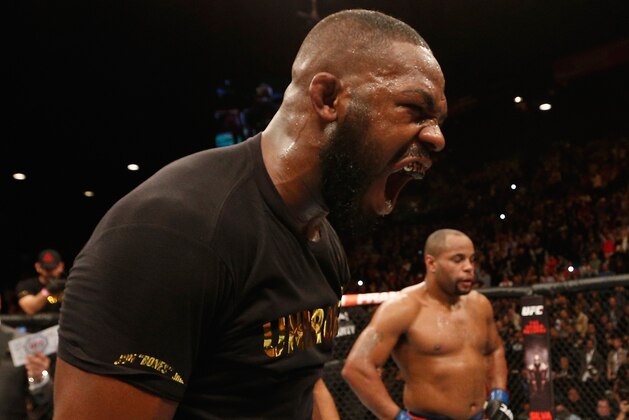 LAS VEGAS, NV - JANUARY 03:  UFC light heavyweight champion Jon Jones (L) celebrates his win over Daniel Cormier (R) in their UFC light heavyweight championship bout during the UFC 182 event at the MGM Grand Garden Arena on January 3, 2015 in Las Vegas, Nevada.  (Photo by Josh Hedges/Zuffa LLC/Zuffa LLC via Getty Images)