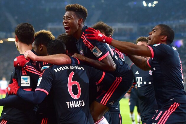 Bayern Munich's players celebrate winning the German first division football Bundesliga match Hamburg HSV vs Bayern Munich in Hamburg, north Germany on January 22, 2016. / AFP / John MACDOUGALL / RESTRICTIONS: DURING MATCH TIME: DFL RULES TO LIMIT THE ONLINE USAGE TO 15 PICTURES PER MATCH AND FORBID IMAGE SEQUENCES TO SIMULATE VIDEO. == RESTRICTED TO EDITORIAL USE == FOR FURTHER QUERIES PLEASE CONTACT DFL DIRECTLY AT + 49 69 650050
        (Photo credit should read JOHN MACDOUGALL/AFP/Getty Images)