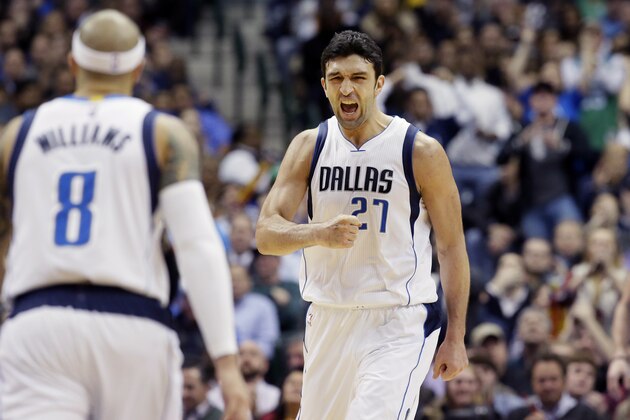 Dallas Mavericks center Zaza Pachulia (27) reacts to scoring a basket in front of teammate Deron Williams (8) during the first half of an NBA basketball game against the Cleveland Cavaliers Tuesday, Jan. 12, 2016, in Dallas. (AP Photo/LM Otero)
