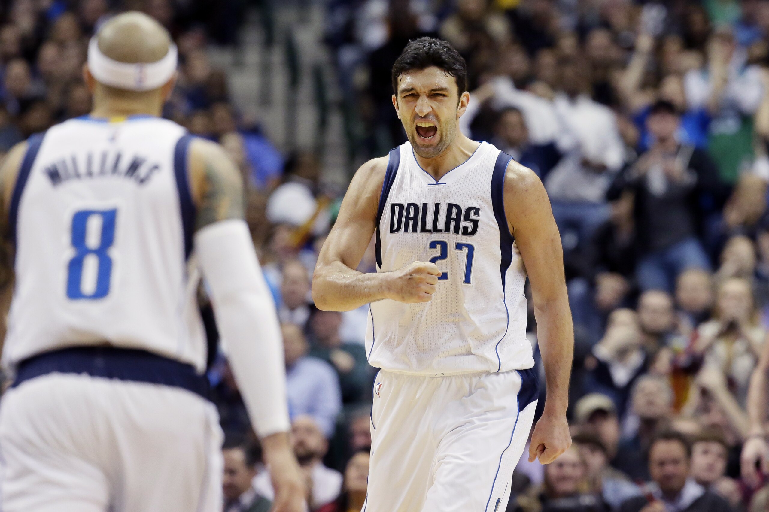 Dallas Mavericks center Zaza Pachulia (27) reacts to scoring a basket in front of teammate Deron Williams (8) during the first half of an NBA basketball game against the Cleveland Cavaliers Tuesday, Jan. 12, 2016, in Dallas. (AP Photo/LM Otero)