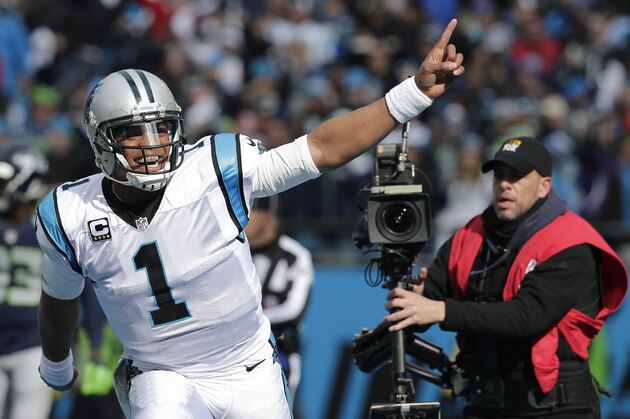 Carolina Panthers quarterback Cam Newton (1) celebrates a Carolina Panthers running back Jonathan Stewart touchdown against the Seattle Seahawks during the first half of an NFL divisional playoff football game, Sunday, Jan. 17, 2016, in Charlotte, N.C. (AP Photo/Chuck Burton)