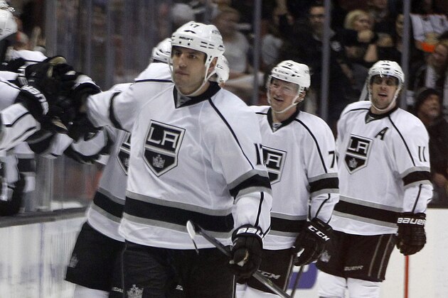 Los Angeles Kings left wing Milan Lucic, center, celebrates with the bench players after center Tyler Toffoli, second from right, scores as center Anze Kopitar, right, of Slovenia, looks on during the second period of an NHL hockey game against the Anaheim Ducks in Anaheim, Calif., Sunday, Jan. 17, 2016. (AP Photo/Alex Gallardo)