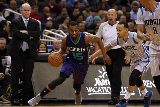 Jan 22, 2016; Orlando, FL, USA; Charlotte Hornets guard Kemba Walker (15) drives to the basket as Orlando Magic guard Shabazz Napier (13) defends during the first quarter at Amway Center. Mandatory Credit: Kim Klement-USA TODAY Sports