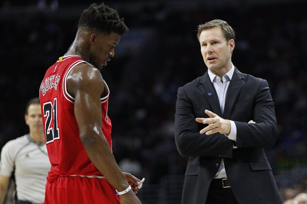 Chicago Bulls' head coach Fred Hoiberg, right, talks with Jimmy Butler, left, during the first half of an NBA basketball game against the Philadelphia 76ers, Thursday, Jan. 14, 2016, in Philadelphia. The Bulls won 115-111 in overtime. (AP Photo/Chris Szagola)