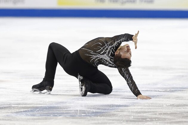 Adam Rippon performs in the men's short program of the U.S. Figure Skating Championships, Friday, Jan. 22, 2016, in St. Paul, Minn.  Rippon finished in third place. (AP Photo/Jim Mone)
