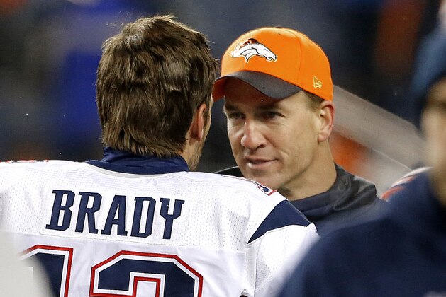 New England Patriots quarterback Tom Brady (12) greets Denver Broncos injured quarterback Peyton Manning prior to an NFL football game, Sunday, Nov. 29, 2015, in Denver. (AP Photo/Joe Mahoney)