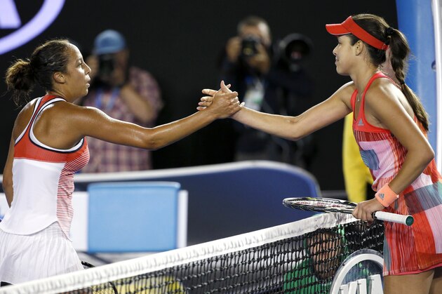 Madison Keys, left, of the United States is congratulated by Ana Ivanovic of Serbia after winning their third round match at the Australian Open tennis championships in Melbourne, Australia, Saturday, Jan. 23, 2016.(AP Photo/Vincent Thian)