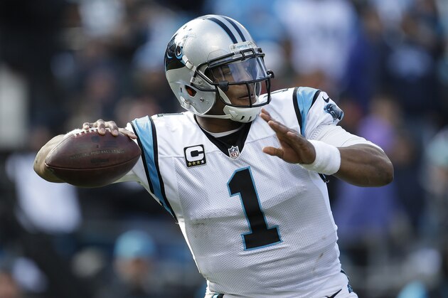 Carolina Panthers quarterback Cam Newton (1) works against the Seattle Seahawks during the first half of an NFL divisional playoff football game, Sunday, Jan. 17, 2016, in Charlotte, N.C. (AP Photo/Bob Leverone)