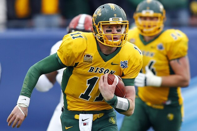 North Dakota State quarterback Carson Wentz (11) performs during the FCS championship NCAA college football game between North Dakota State and Jacksonville State, Saturday, Jan. 9, 2016, in Frisco, Texas.  North Dakota State beat Jacksonville State 37-10 to win their fifth consecutive championship.  (AP Photo/Mike Stone)